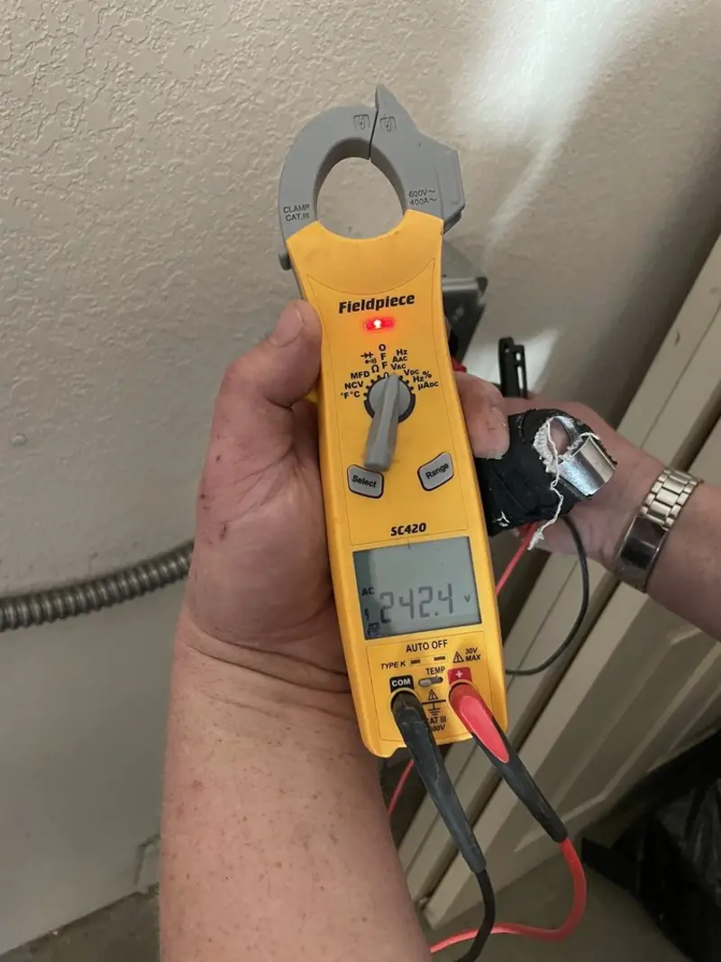 Voltage testing with clamp meter during Whole House Surge Protector in Bacliff